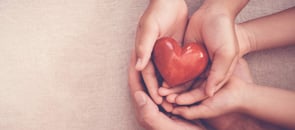 hands holding a heart shaped item