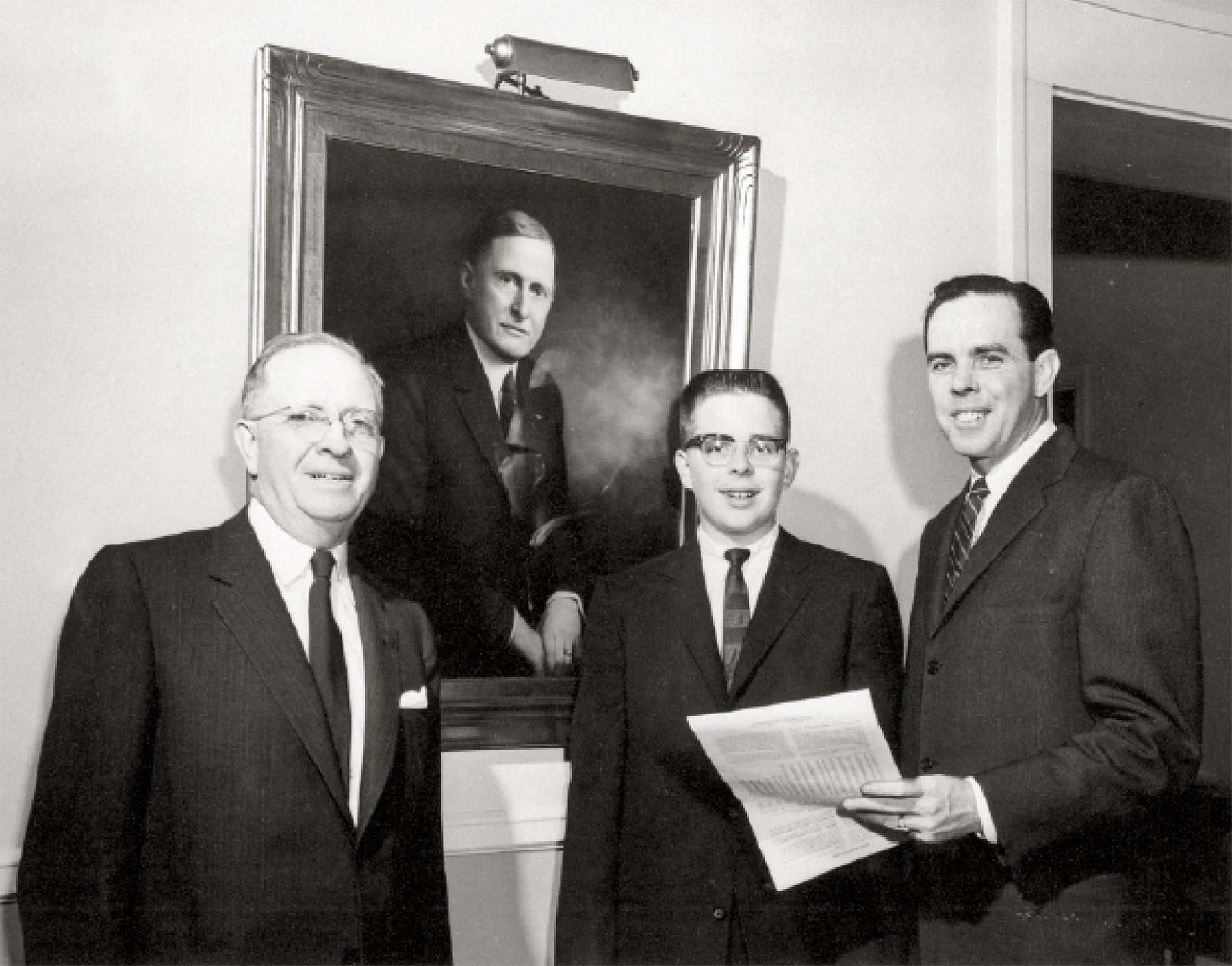  Michel McCord receiving his life insurance policy, the first issued by Illinois Mutual Life and Casualty.