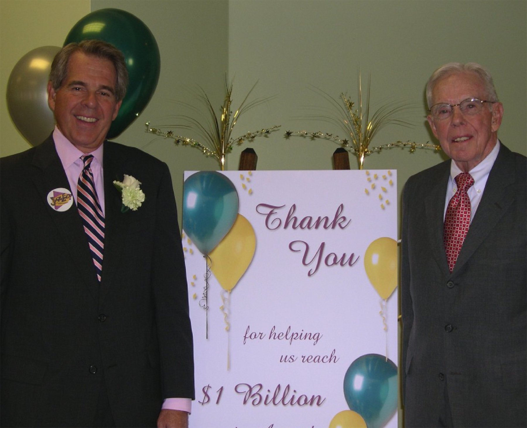 Illinois Mutual President Michel McCord and Chairman R.A. McCord celebrating $1 billion in assets.