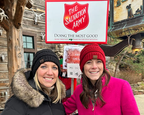 Two Illinois Mutual employees ringing bells for The Salvation Army donations