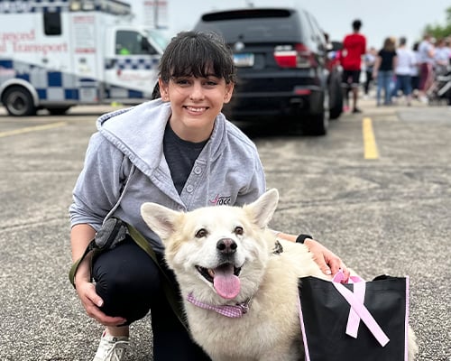 An Illinois Mutual employee with their dog at the More Than Pink Walk