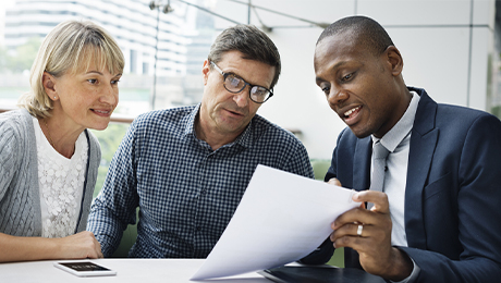 mature couple meeting with an insurance agent