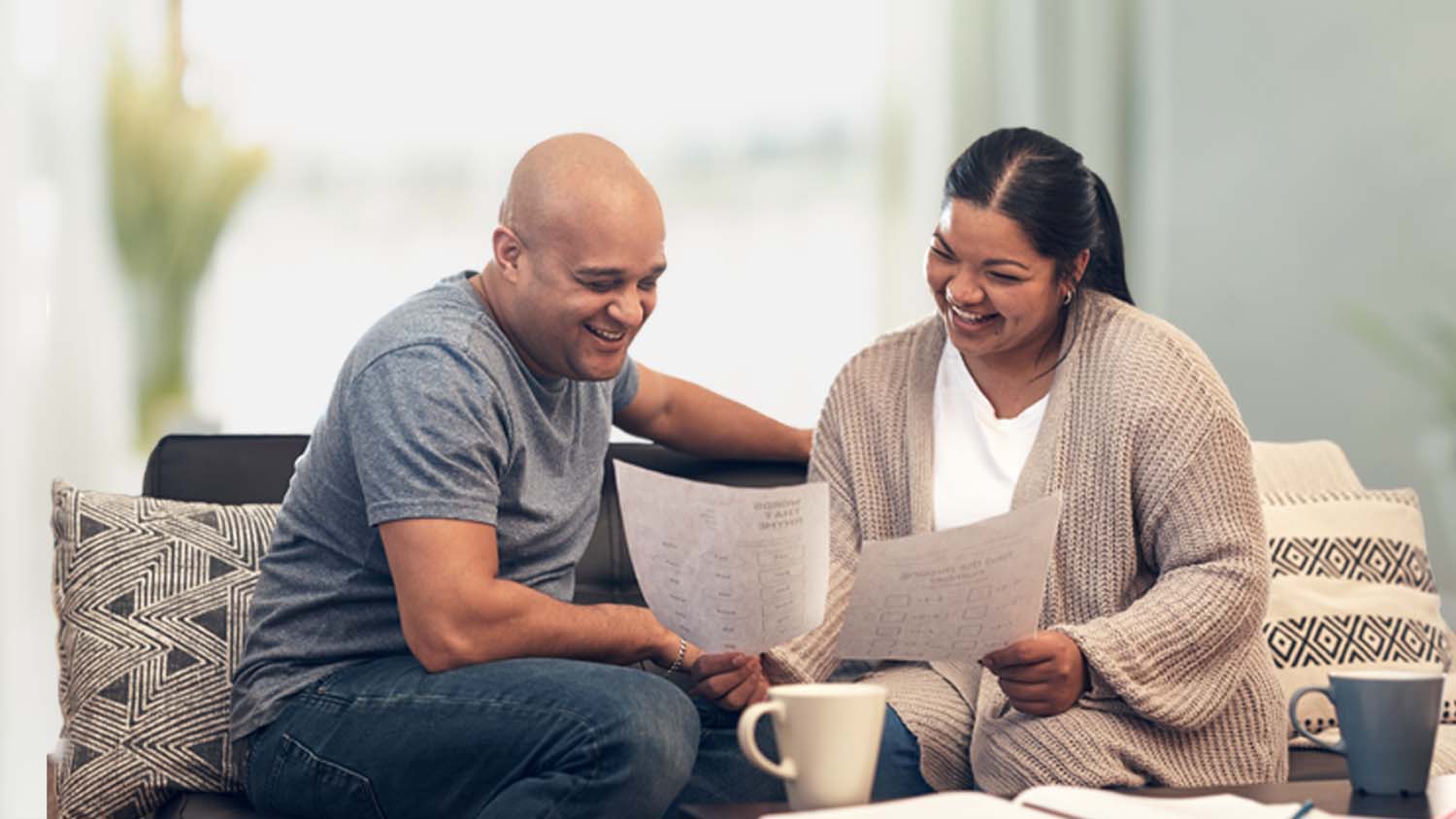 husband and wife looking at paperwork together