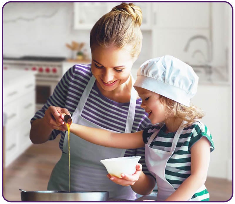 mother and daughter cooking together