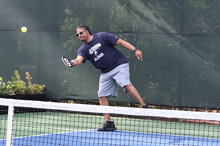pickleball player serving