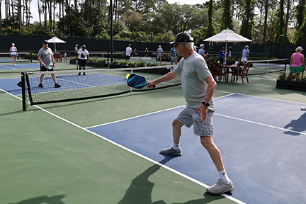 pickleball player hitting the ball