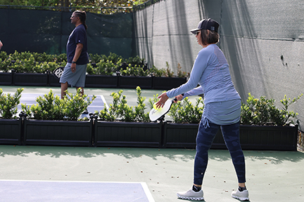 pickleball player ready to serve