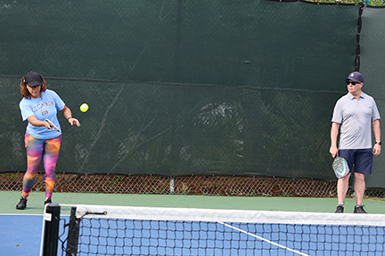 pickleball teammates in the middle of a match
