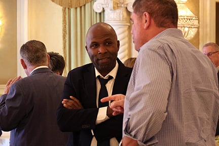 agents talking at the awards dinner