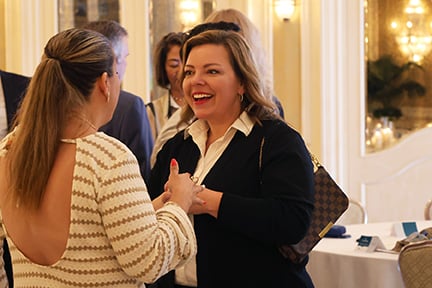 Katie talking to an agent at the awards dinner