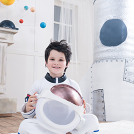 young boy in an astronaut costume