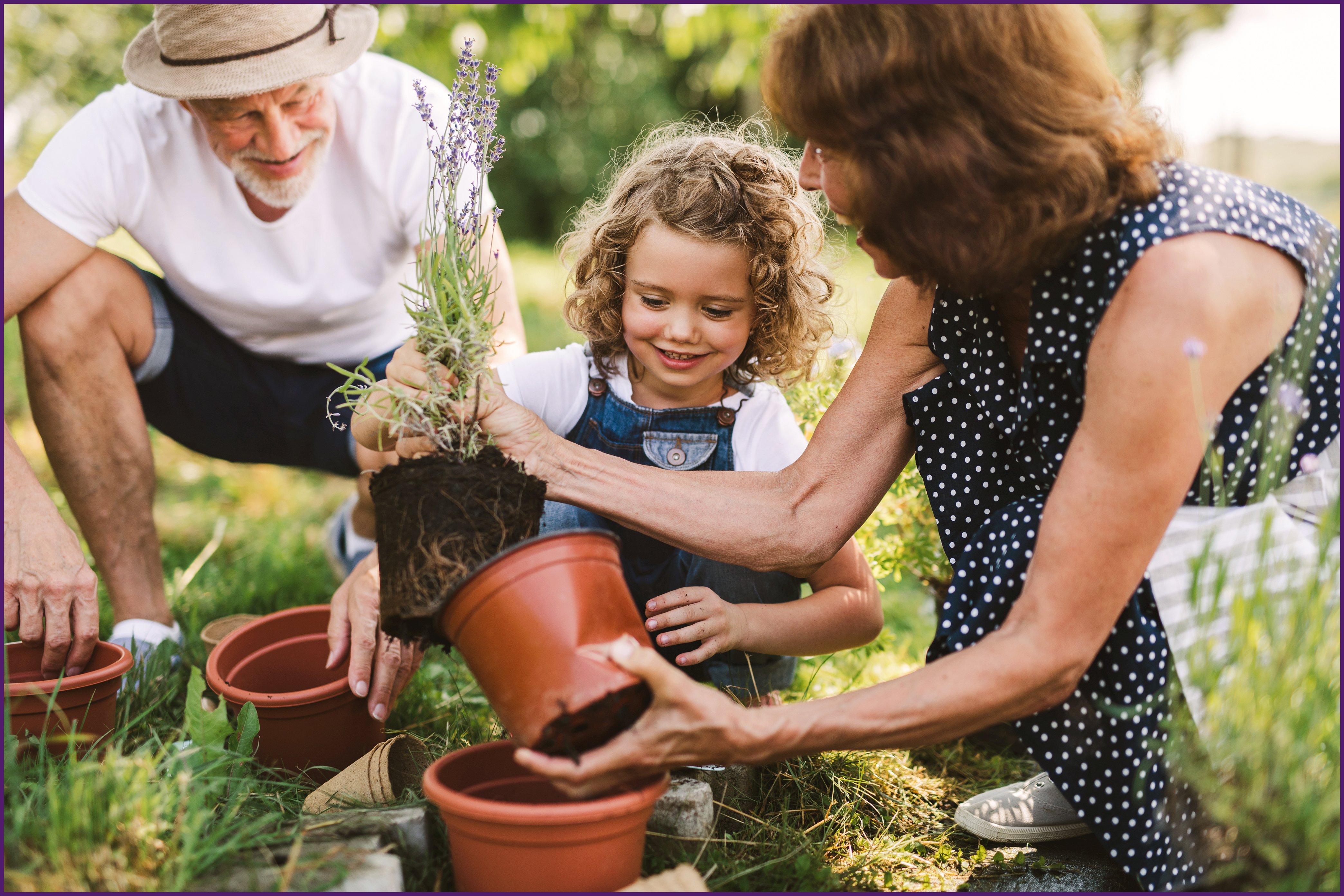 creating-a-legacy-2-ol image of a family outside potting plants