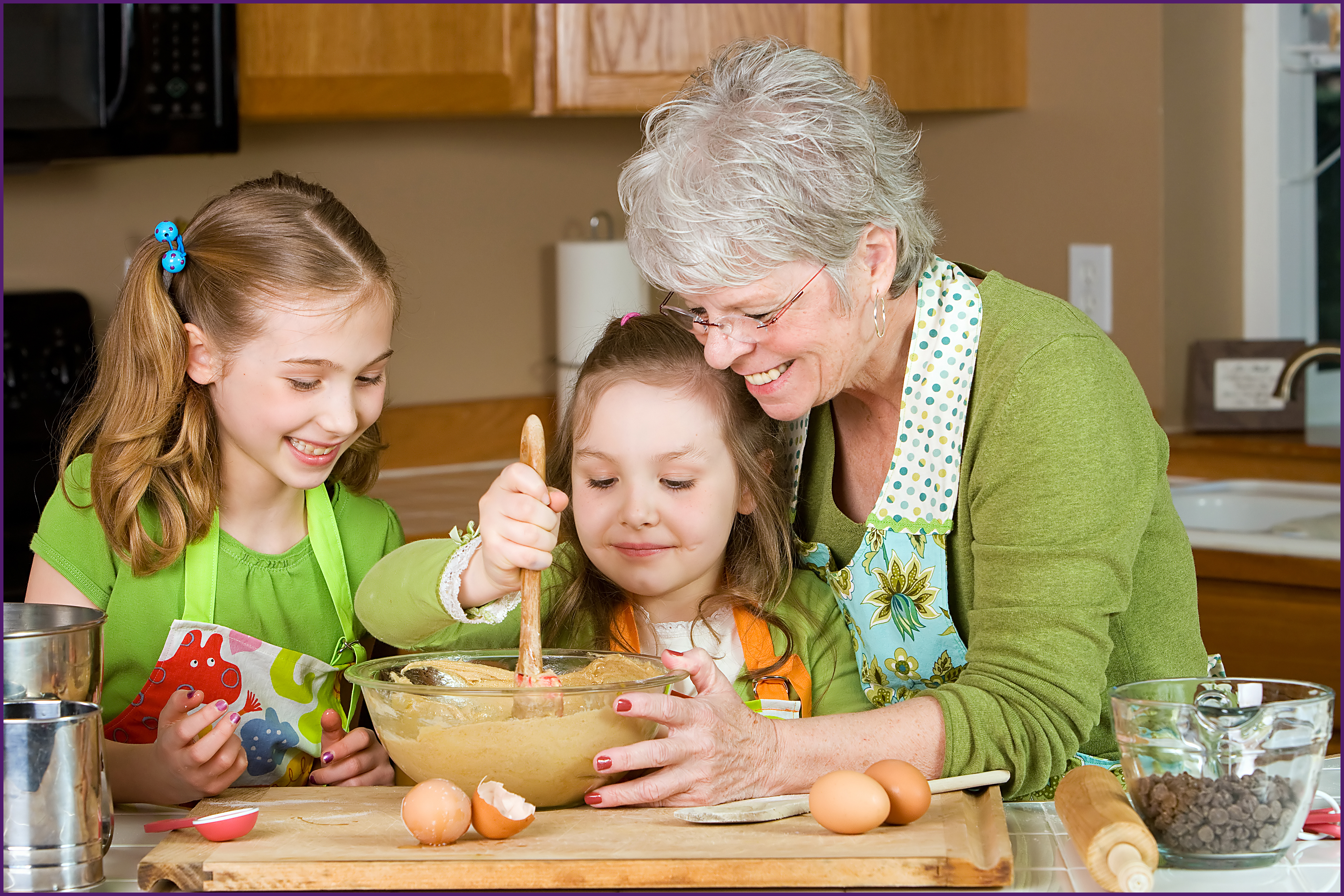 creating-a-legacy-3-ol image of a grandmother teaching grandchildren how to bake