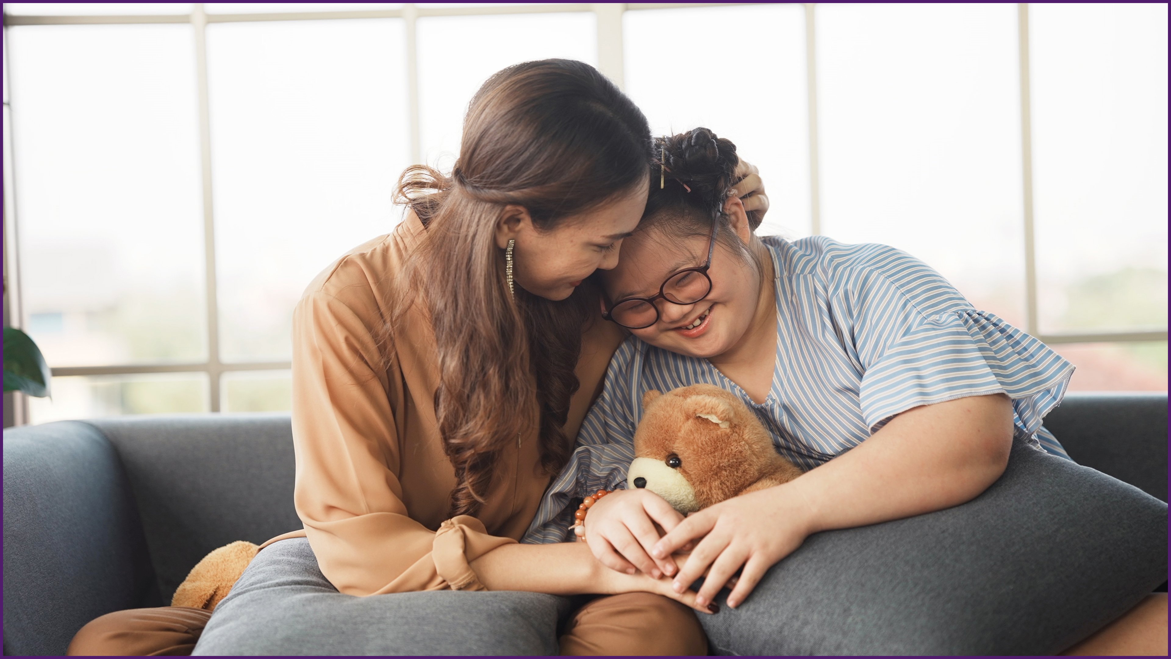 image of a mother on the couch with her child