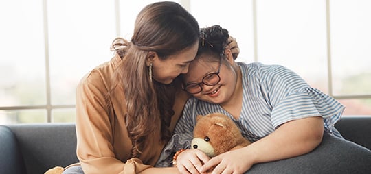 mother and daughter embracing