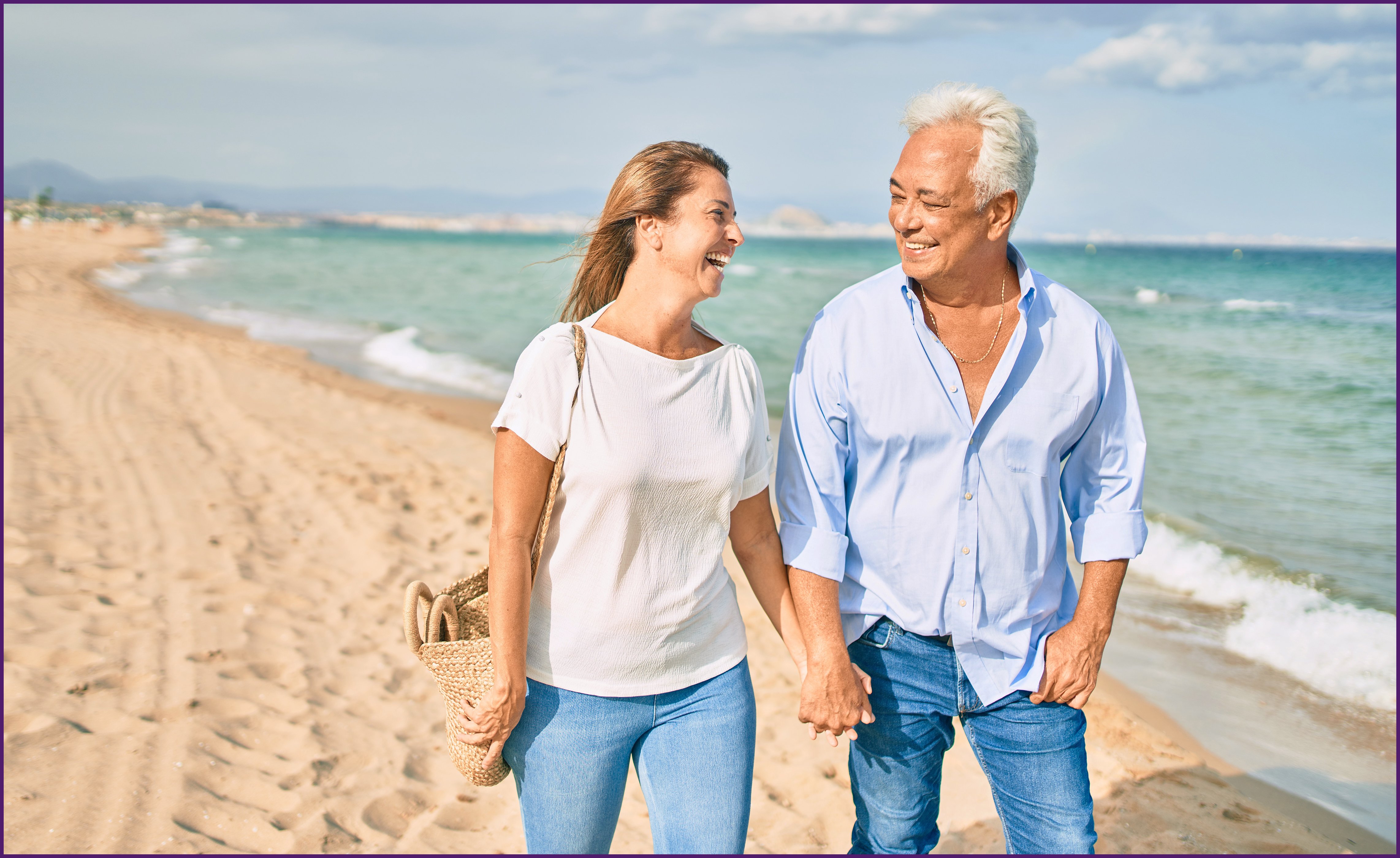 empty-nester-2-ol image of a couple walking along the beach