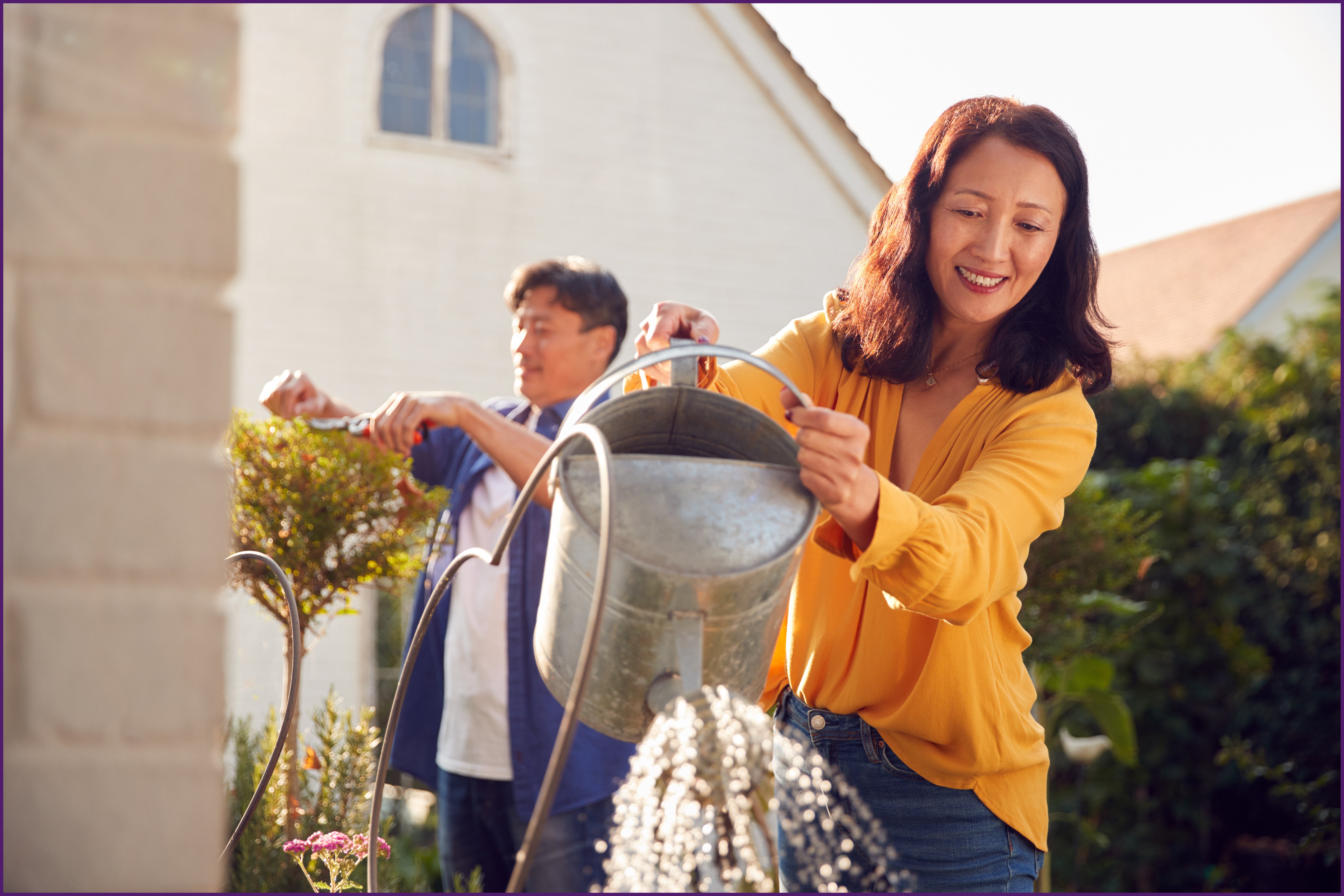 empty-nester-3-ol image of a couple outside doing lawncare