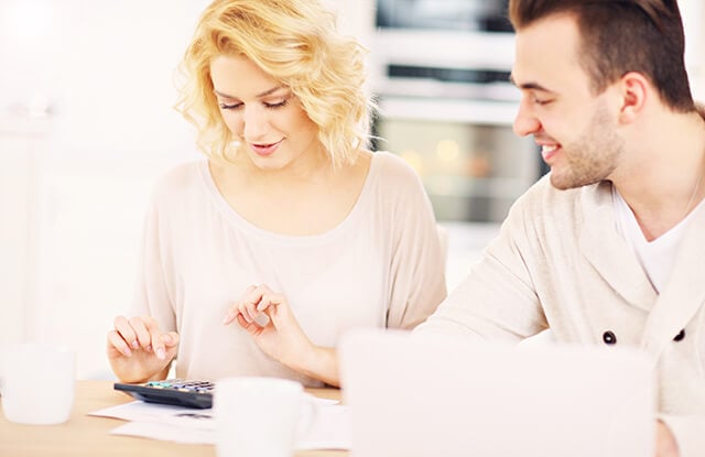 young couple looking over finances