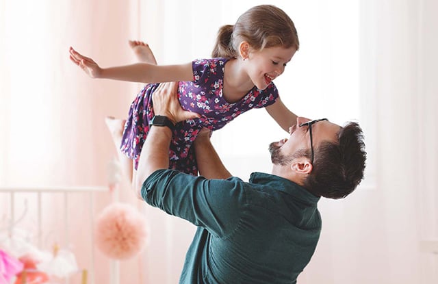 father and daughter playing