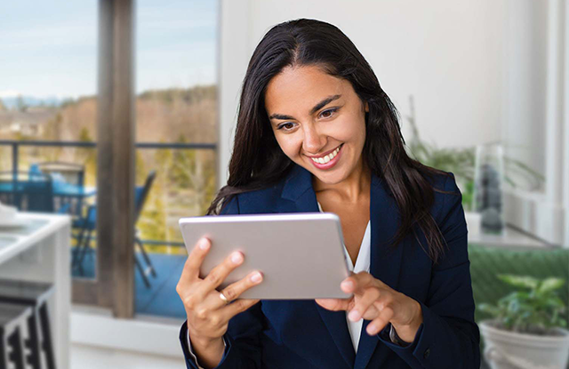 business professional watching something on her tablet