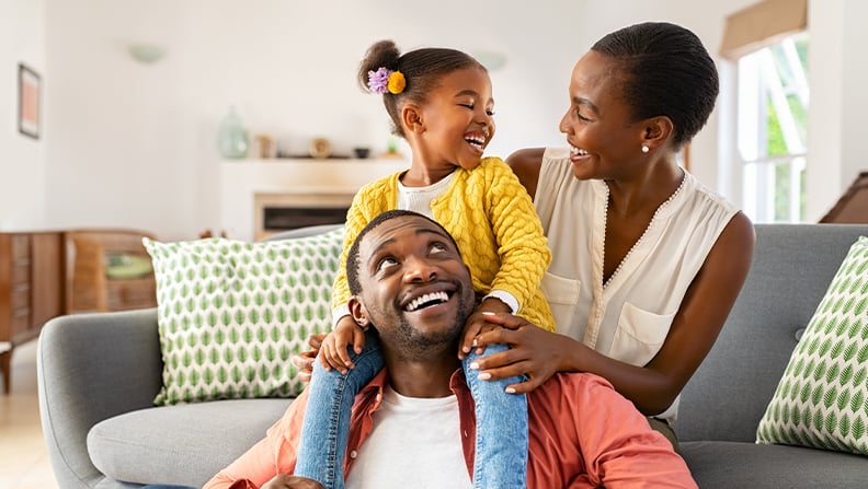 image of a happy family of three inside their home