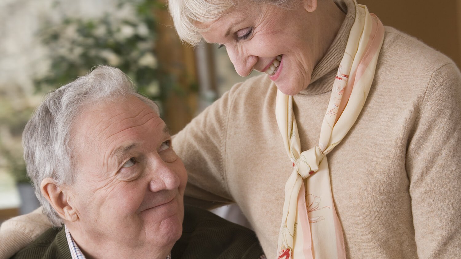 senior couple smiling at each other