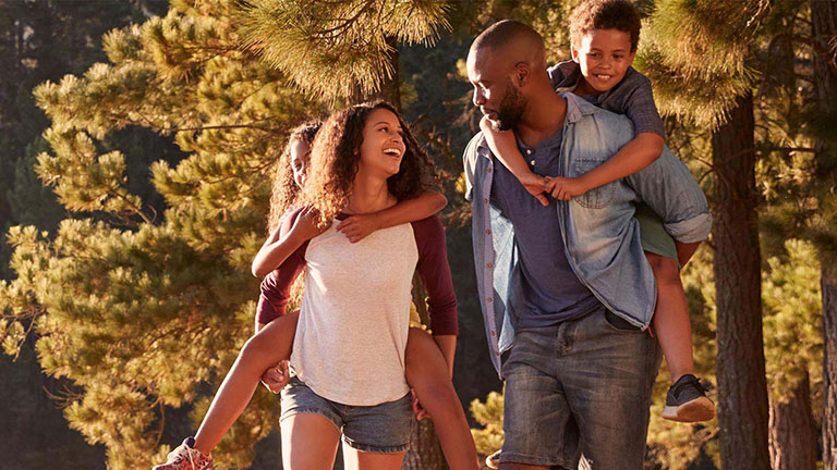 young family outside hiking