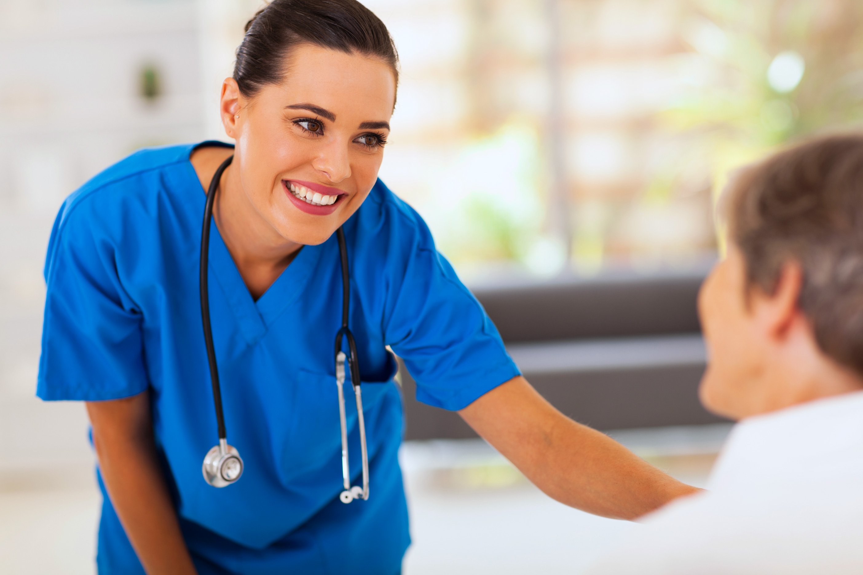 image of a nurse helping her client