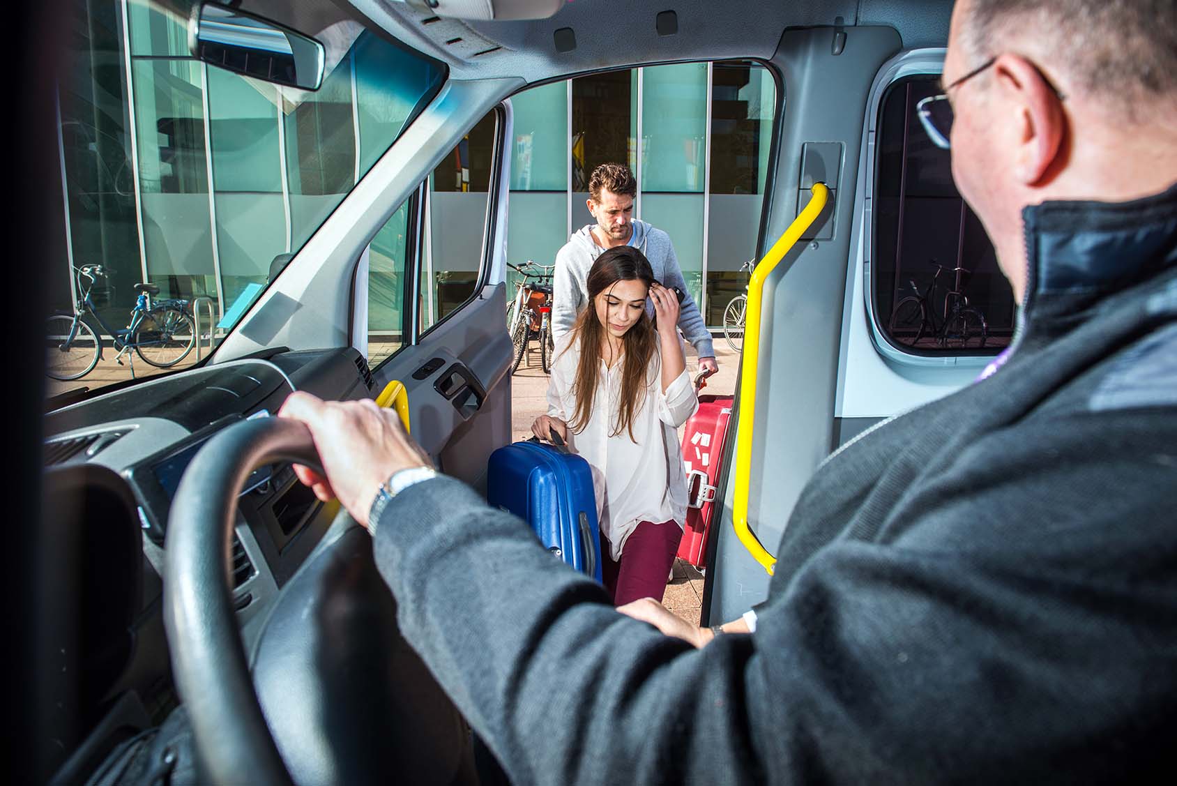 image of taxi driver picking up and man and woman